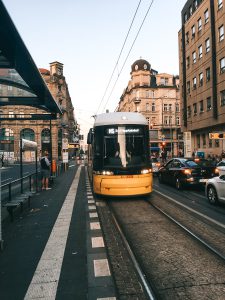 Yellow and Black Bus Near Waiting Shed  By Tomer Levi Forex